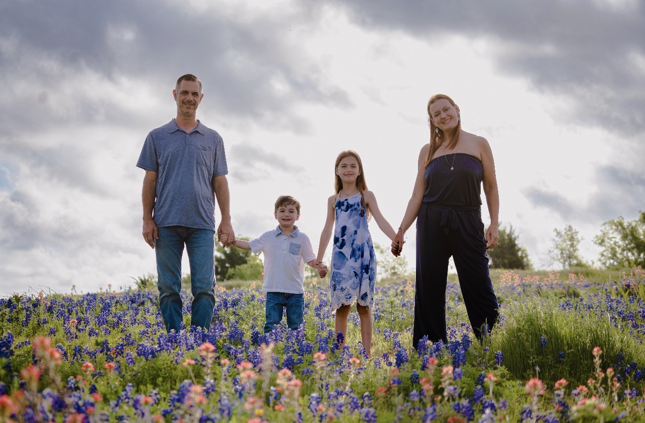 Rebecca Gugeler, Clinic Director at My Higher Healing in Southlake, TX, with her husband and two children
